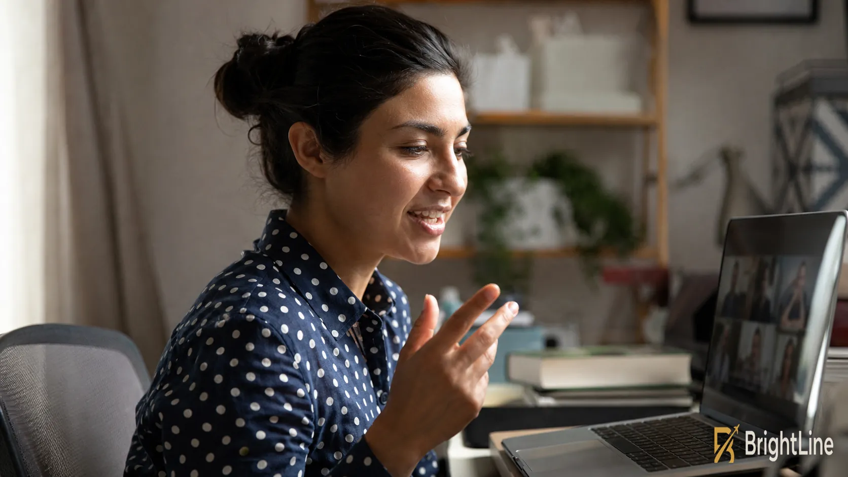 BrightLine remote specialist on a video call with the team from her home office